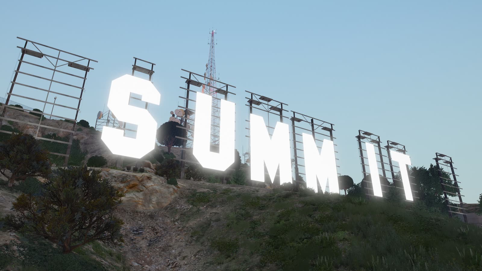 The Summit City sign above the city at dusk